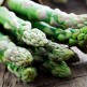 Bunch of fresh asparagus on wooden table